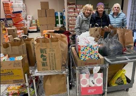 Brown County Community Woman’s Club at Hope Center Pantry with donations