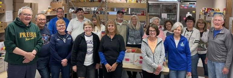 volunteers at Hope Center Pantry sort donations from the Letter Carrier Food Drive